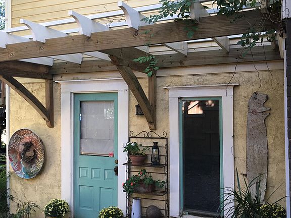 Wisteria-covered arbor shelters your entrance.