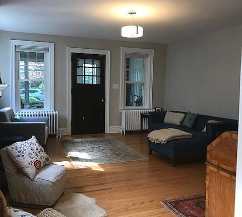 Living room looking toward the front door and enclosed front porch.