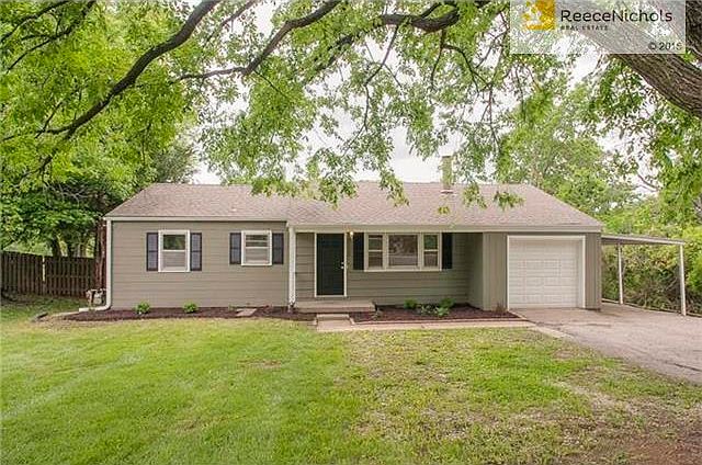 Darling freshly painted ranch with new garage and an additional carport.