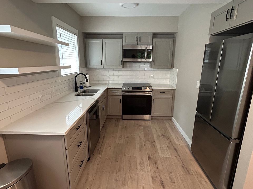 Updated kitchen with electric appliances including a food disposal
