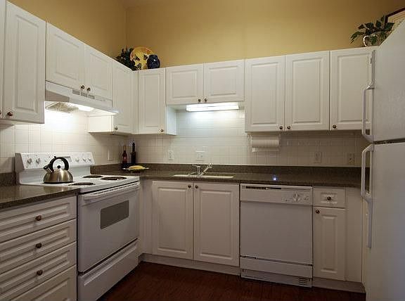 Kitchen also has hardwoods and tall ceiling 