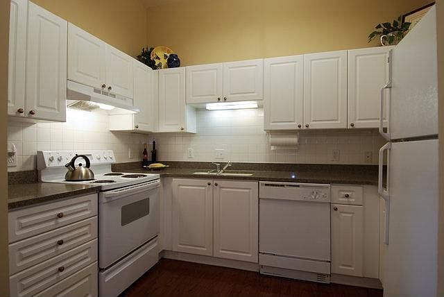 Kitchen also has hardwoods and tall ceiling 