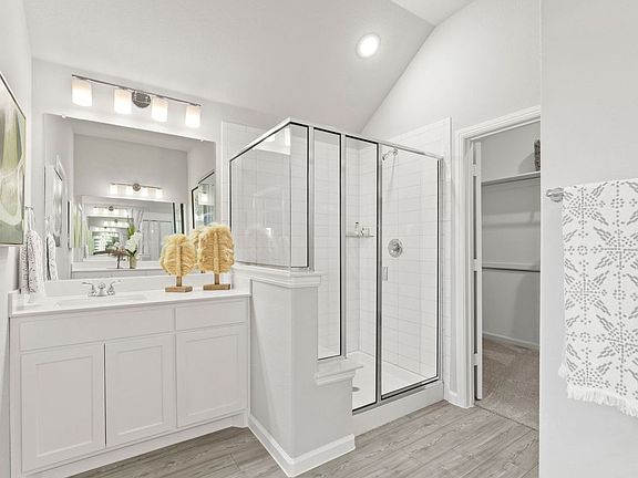 Primary Bathroom in the Diamond home plan by Trophy Signature Homes - REPRESENTATIVE PHOTO