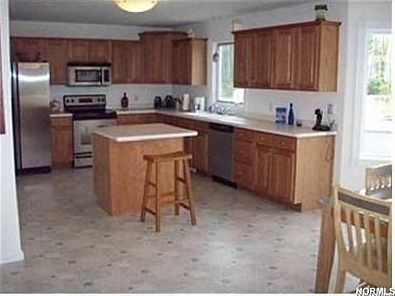 large kitchen with stainless steel appliances