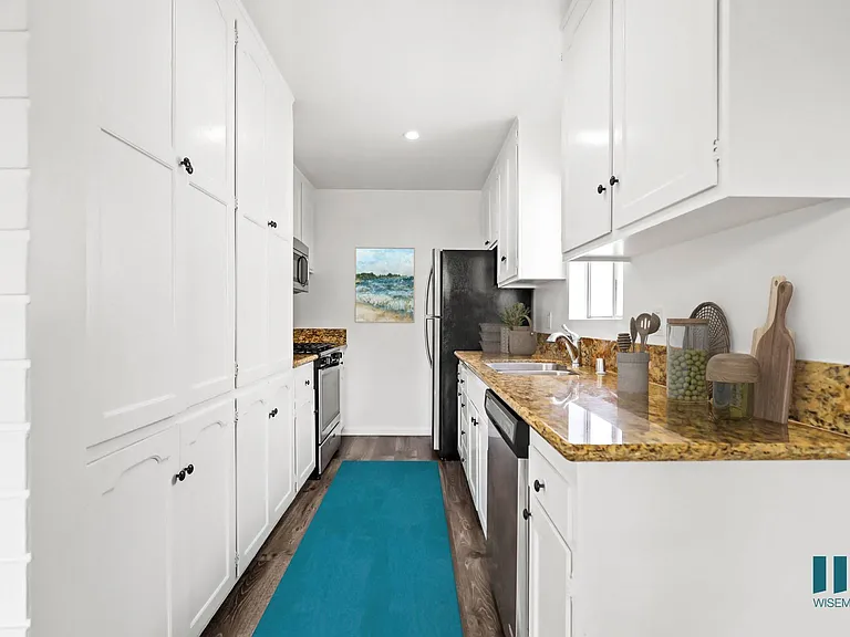 Kitchen with Stainless-Steel Refrigerator, Stove, Microwave Oven, and Dishwasher