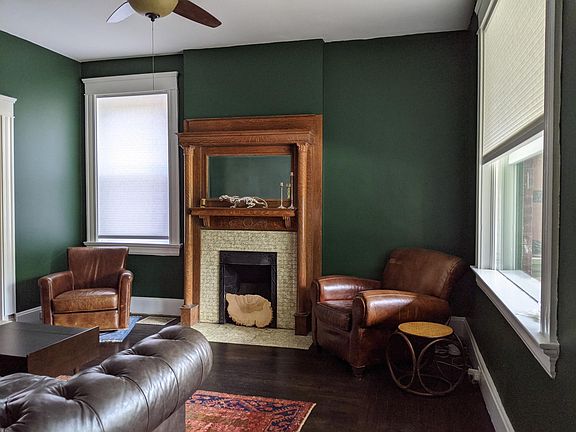 Living Room - has a beautiful 100-year old carved oak fireplace. 
(Doesn't work but looks amazing. Mantle underside has stocking hooks).