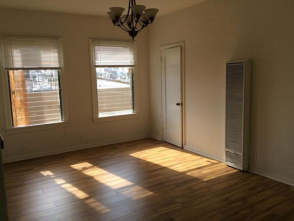 Livingroom with large windows and Laminate Floors