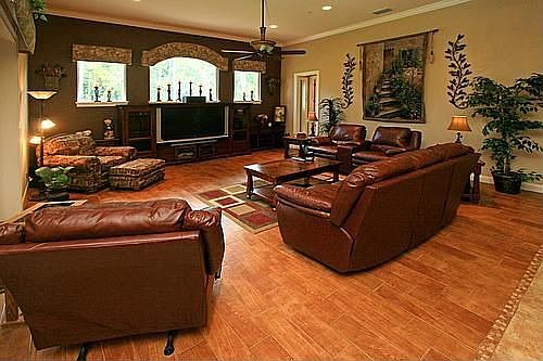 Large Family Room with Tile Floor That Looks Like Wood
