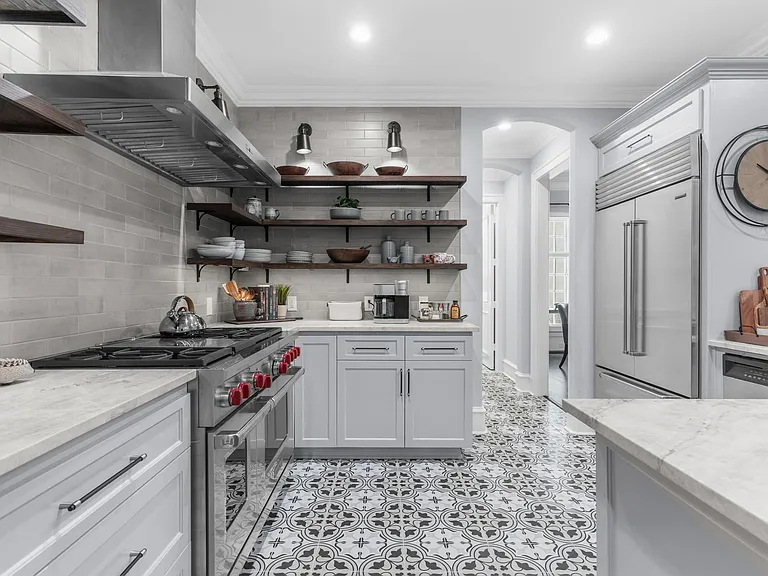 Top-of-the-line Wolf range and designer open shelving.