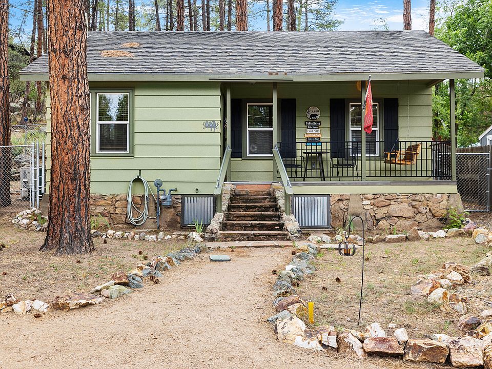 Enjoy the views of the pines from the covered front porch.