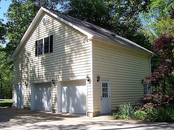 Finished bonus room over extra large etached garage with workroom. 