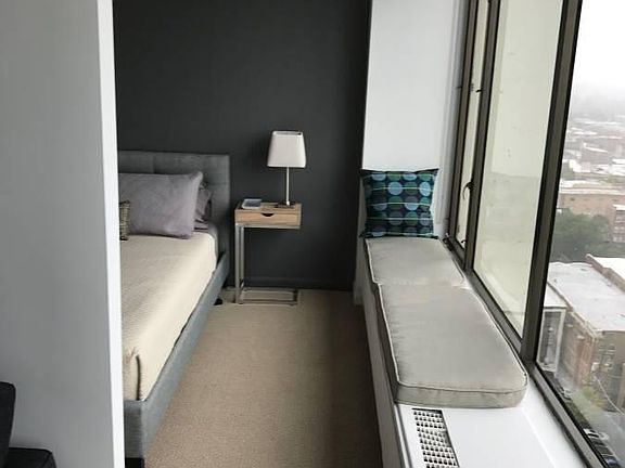 Junior one bedroom with a dividing wall, full windows throug