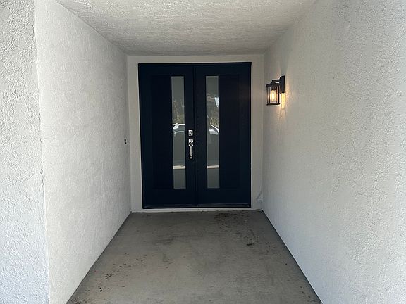 New front door, windows, and lighting.