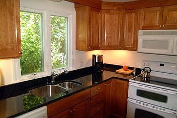 cherry and granite kitchen