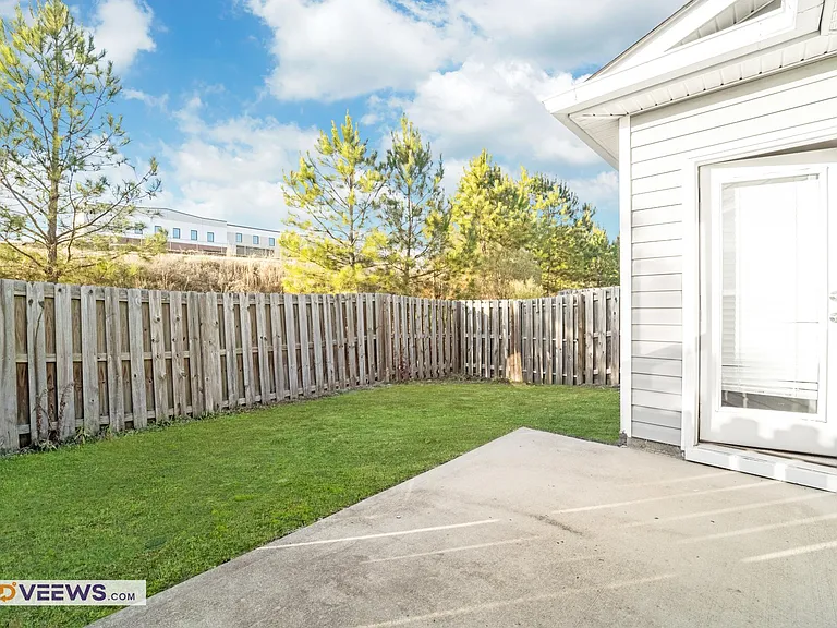 The backyard offers direct access to the bonus room