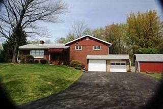 Custom built brick 2-level home nestled on 1 level country acre.