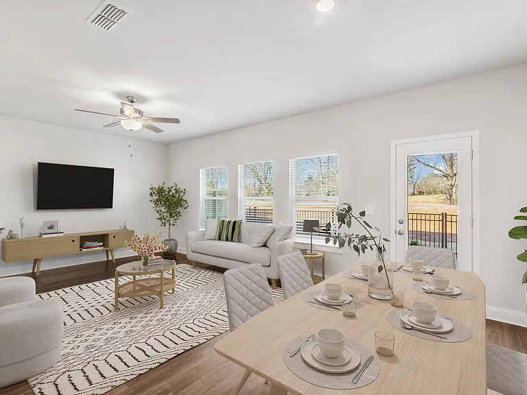 Living room with large window letting in a ton of natural light.