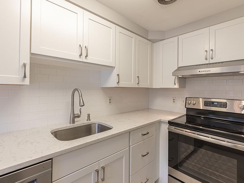 New kitchen cabinets, quartz, SS appliances, lights $ tile floor WOW!