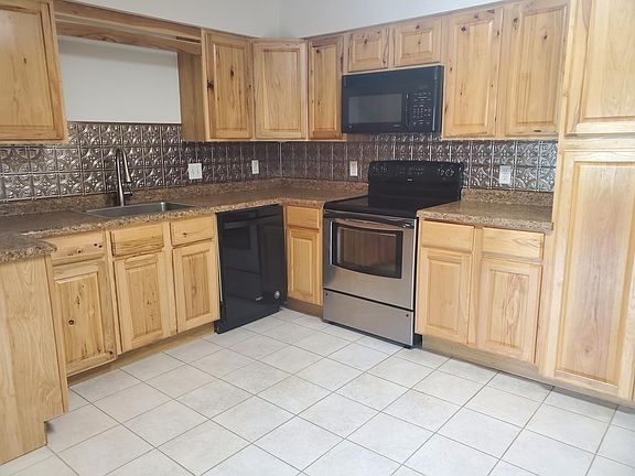 Kitchen- Hickory cabinets- tile floor