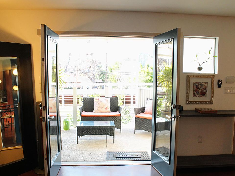 Living room opens into private patio with surround sound speakers