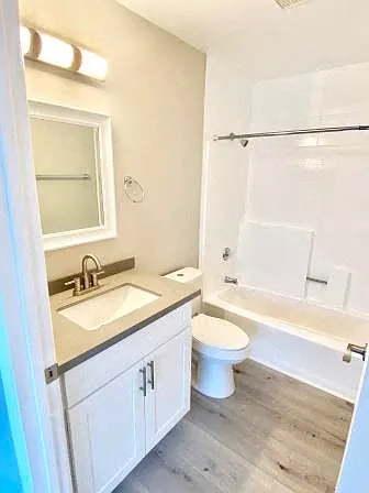 210 Garfield bathroom vanity, toilet, and shower