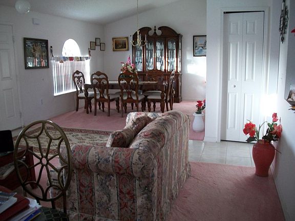Living and dining rooms divided by foyer