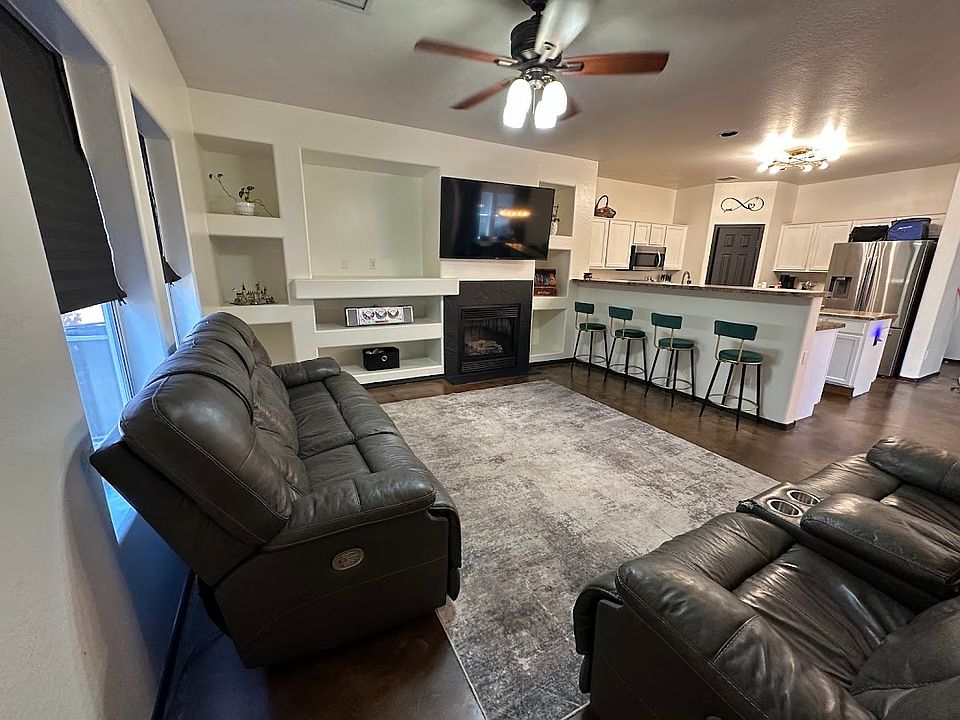 Living room with fireplace and built in media center
