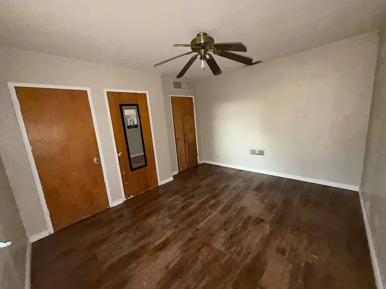 Bedroom #3 Showing door to hallway (on right) and two closets.