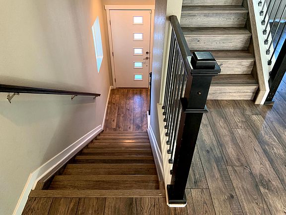 Front door landing. Up to the kitchen/living room.