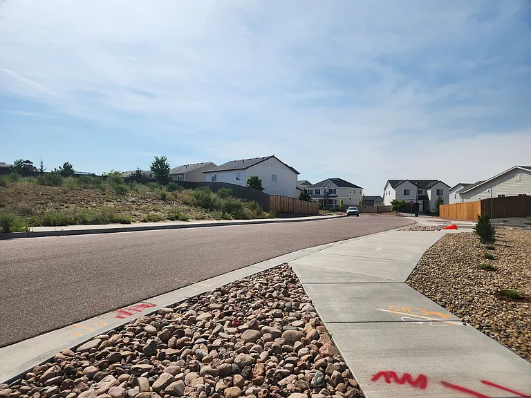 July 2026 View of the back of the house from the corner of Dillinger and Templeton Gap