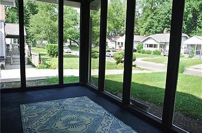 Added privacy screen on spacious front porch for outdoor living.
