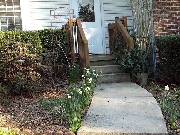 Flower beds out front and small garden bed in back for you t