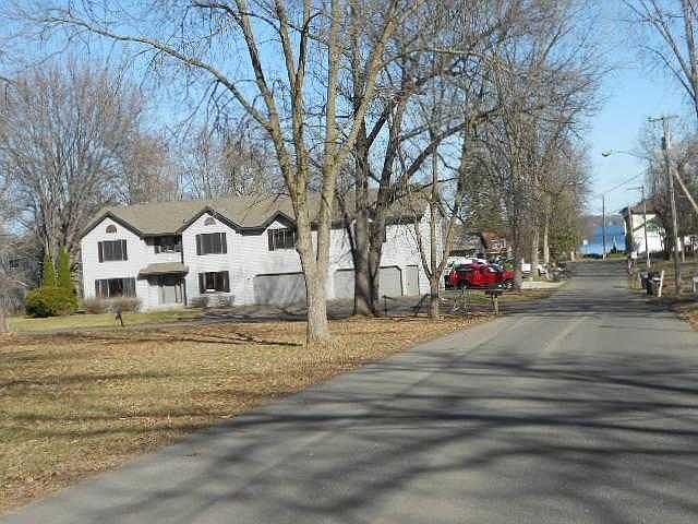 front with lake at end of road