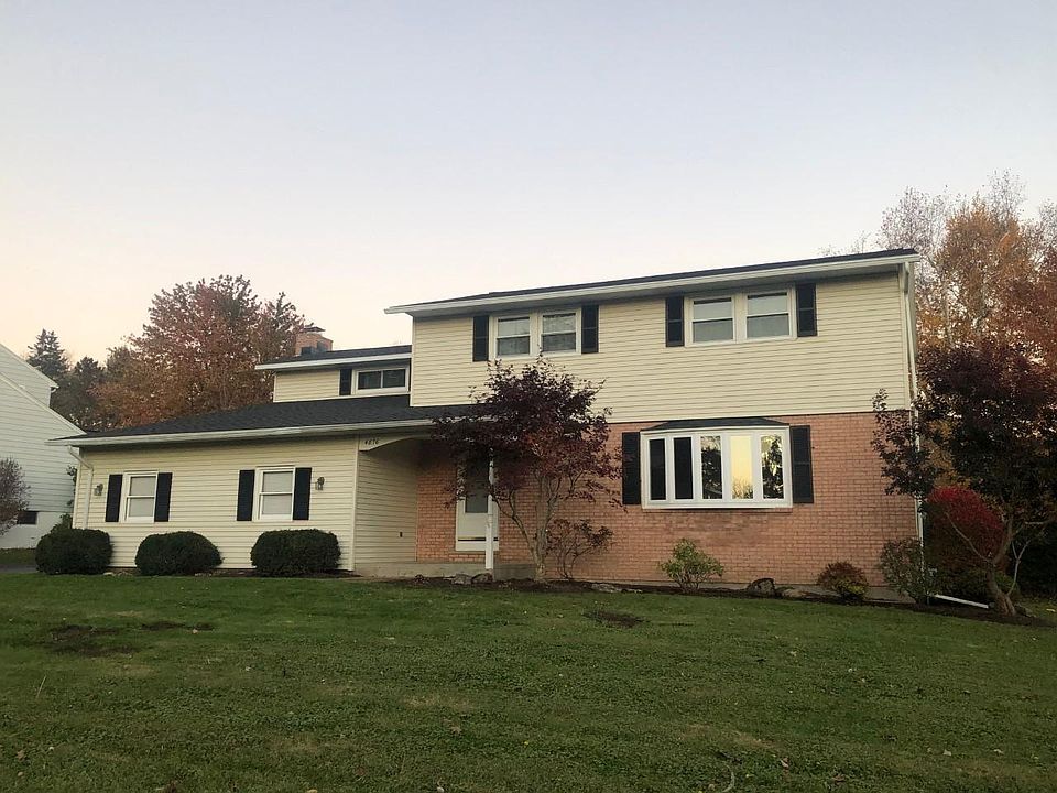 Front of home. Shutters and roof are new, are black, show different than the rest of the pictures.
