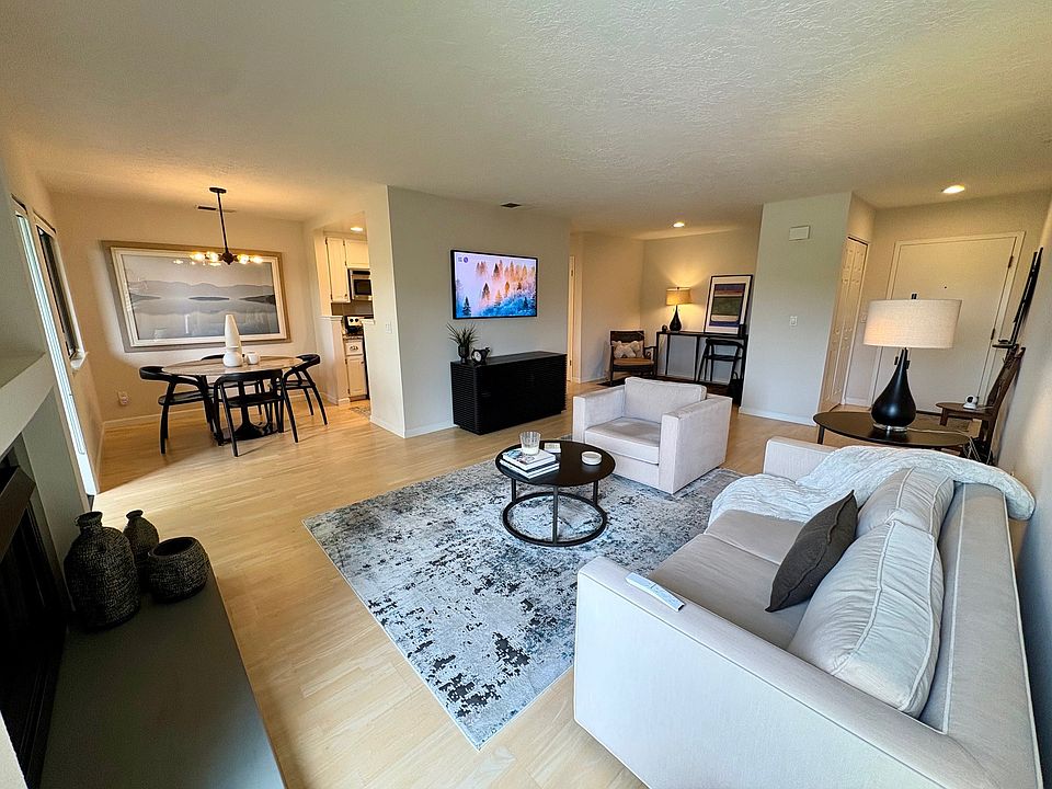 Open floor plan with living, dining and workspace areas