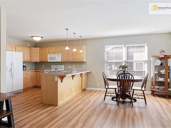 Open kitchen, dining, and living room welcome you in - BRAND NEW flooring!