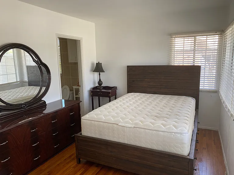 furnished master bedroom with bath
