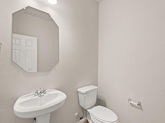 This charming home features a beautifully appointed half bath adjacent to the family room, perfect f