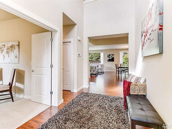 The two-story entry is bright and airy with has sight lines straight through to the back yard