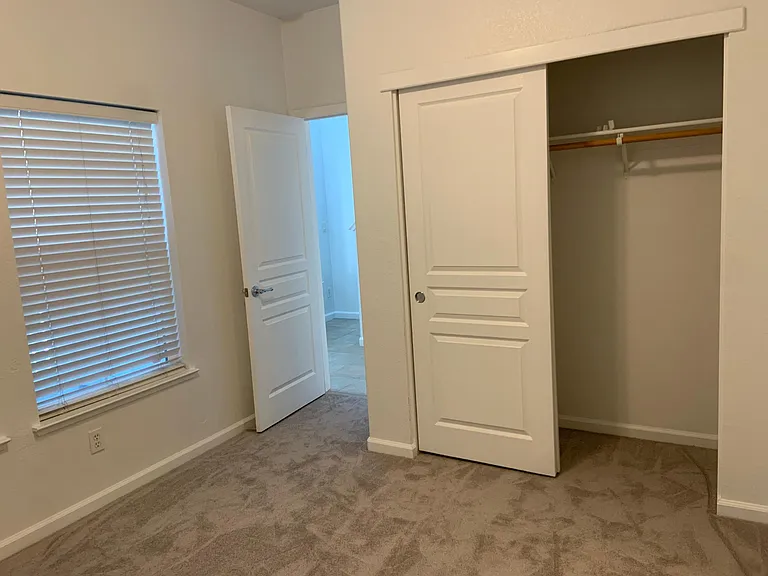 Ground floor bedroom with large closet and en-suite bathroom.