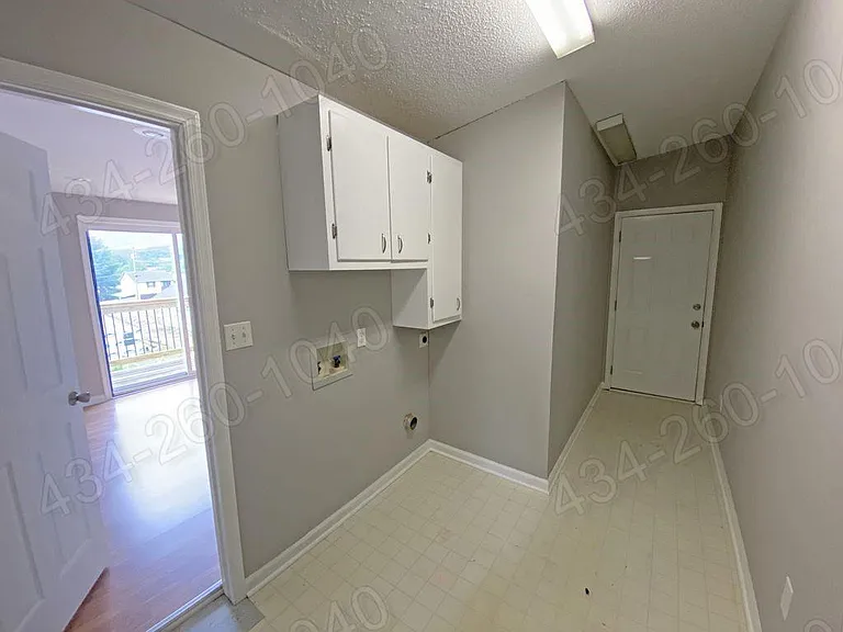 Large Utility / Mud Room with Washer/Dryer Hookups _ and Side Door Access to the Yard