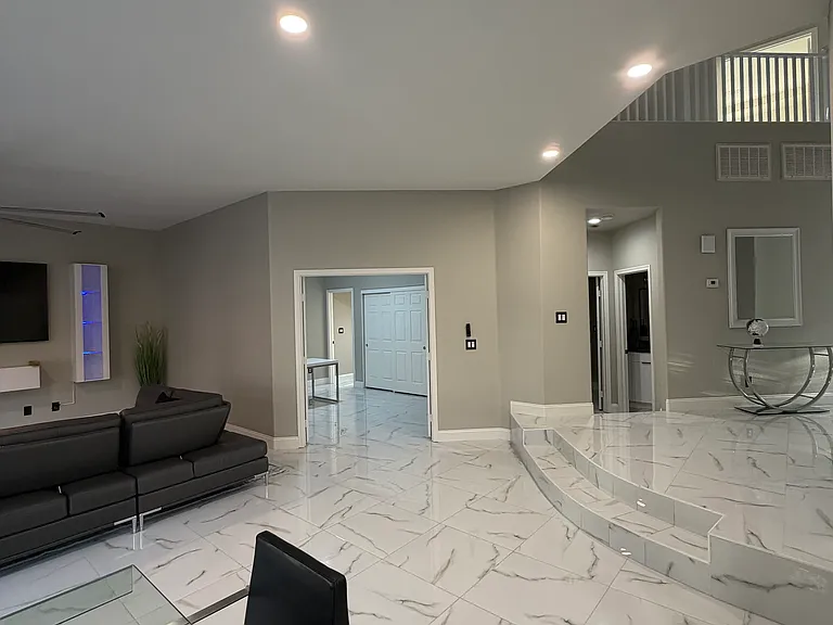 Private office with double-door entry, ideal for a home workspace or flex room.