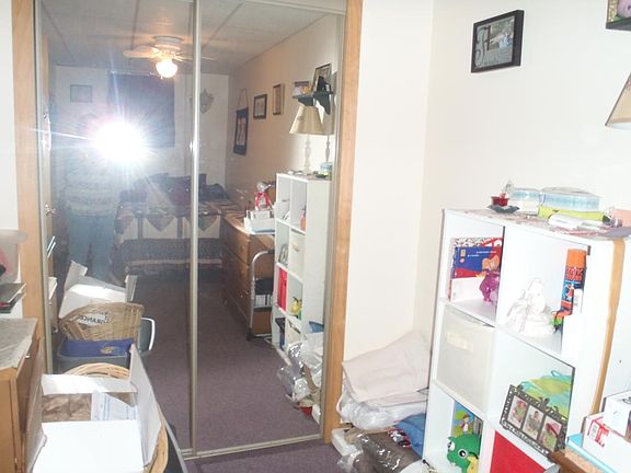 Mirrored closet in bedroom
