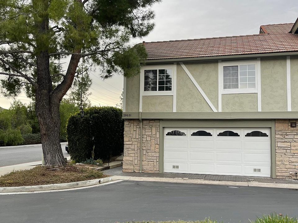 two car garage that is deep for longer cars and extra wide for storage