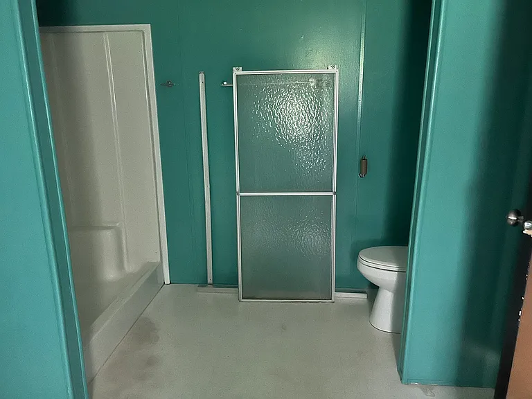 Master bathroom also has a shower. I believe the shower door has been put back in place.