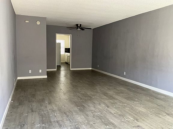 Living room entry with tile flooring tastefully painted