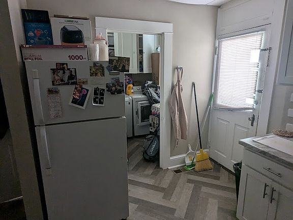 Kitchen with view into laundry room