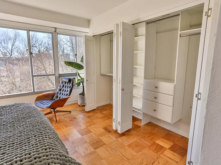 Full wall of closet space can accommodate any shopping addiction.