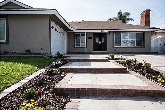 Gorgeous curb appeal with professional landscape