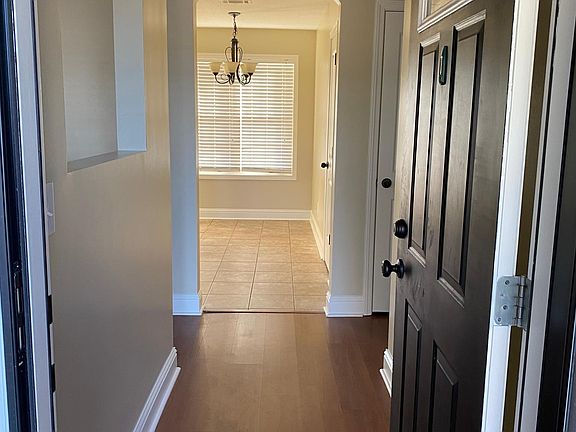 Welcome home: den on the left, kitchen/dinning straight ahead